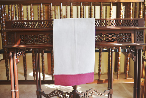 White Hemsitch Guest Towel with Pink Flambe border. 14"x22"